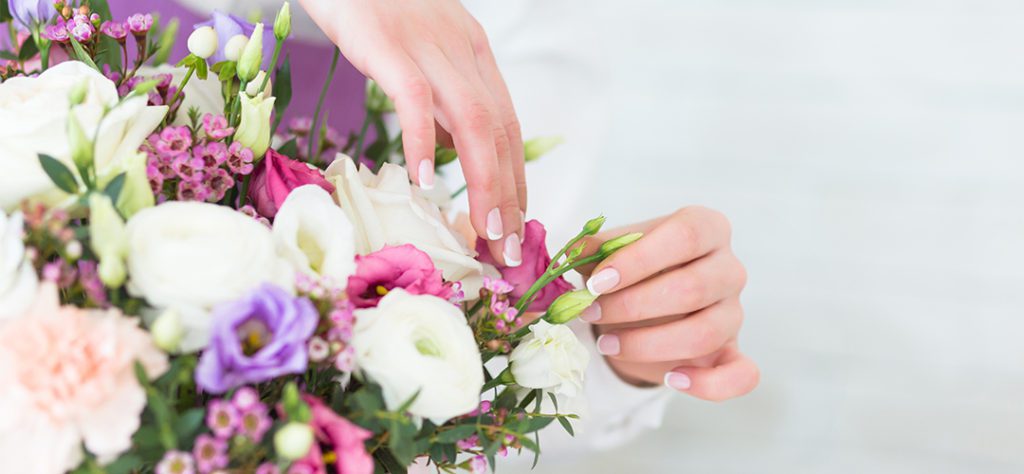 Remove faded and wilted flowers from  arrangements.